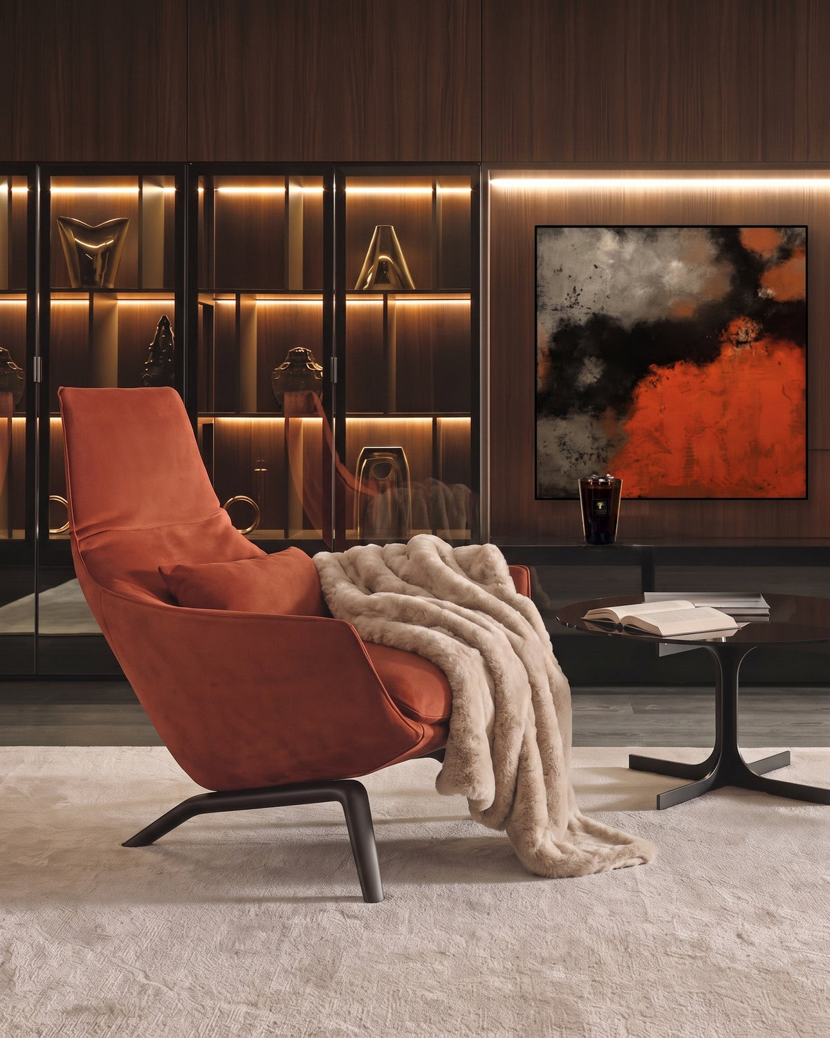 Coin de salon : fauteuil en suède brique, plaid en fausse fourrure beige, toile abstraite rouge et noire, bougie Baobab Collection sur une console